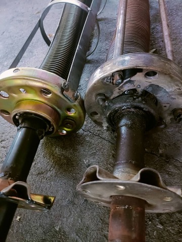 งานเปลี่ยนชุดสปริงเพลาขับประตูม้วน